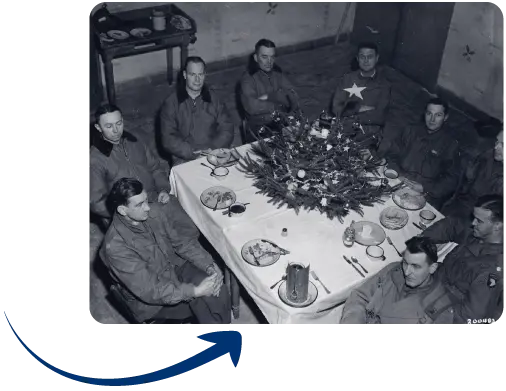 Brigadier General Anthony McAuliffe and his staff gathered inside Bastogne’s Heintz Barracks for Christmas dinner 25 December 1944. Brigadier General Anthony McAuliffe and his staff gathered inside Bastogne's Heintz Barracks for Christmas dinner 25 December 1944.